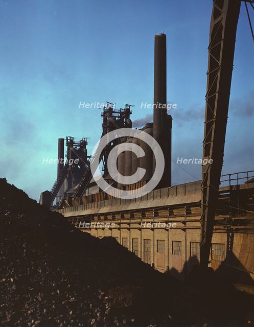 Blast furnaces and iron ore at the Carnegie-Illinois Steel Corporation mills, Etna, Pennsylvania, 19 Creator: Alfred T Palmer.