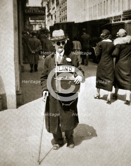 Blind man begging, Great Depression, New York, USA, 1933. Creator: Unknown.