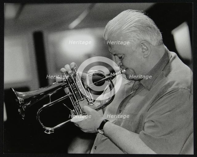 Bruce Adams playing the flugelhorn at The Fairway, Welwyn Garden City, Hertfordshire, 2 June 2002. Artist: Denis Williams