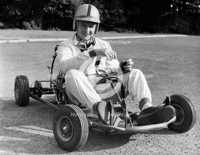 Bruce McLaren on his Em-Bee Wasp kart. Creator: Unknown.