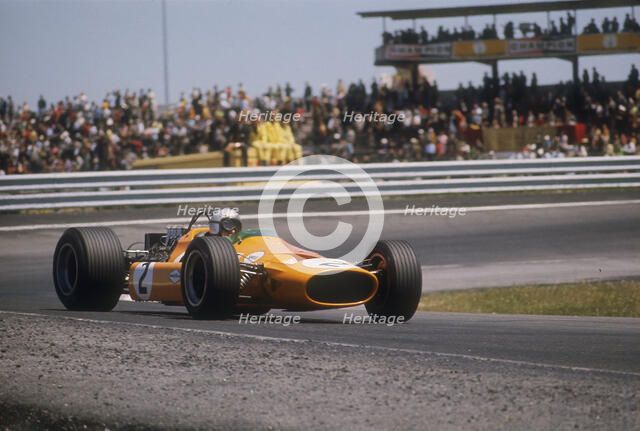 Bruce McLaren's McLaren-Ford, Spanish Grand Prix, Jarama, Madrid, 1968. Artist: Unknown