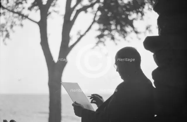 Bruce, Ned, Mr., reading and writing outdoors, 1915? Creator: Arnold Genthe.