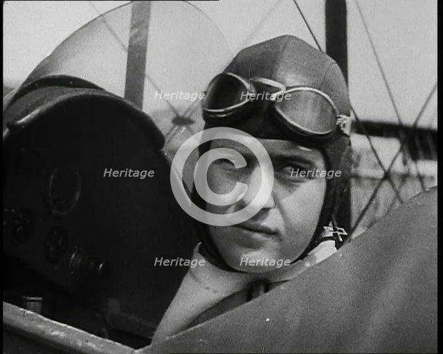 Bruno Mussolini, Son of Italian Leader Benito Mussolini, in Flying Cap Sitting in the..., 1937. Creator: British Pathe Ltd.