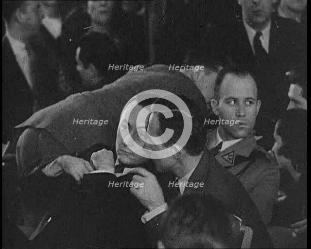 Bruno Richard Hauptmann Speaking To Attorney C. Lloyd Fisher During His Trial in the Lind..., 1930s. Creator: British Pathe Ltd.