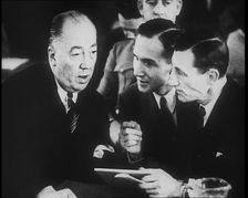 Bruno Richard Hauptmann Talking To His Attorney Edward J. Reilly in a Courtroom During His..., 1930s Creator: British Pathe Ltd