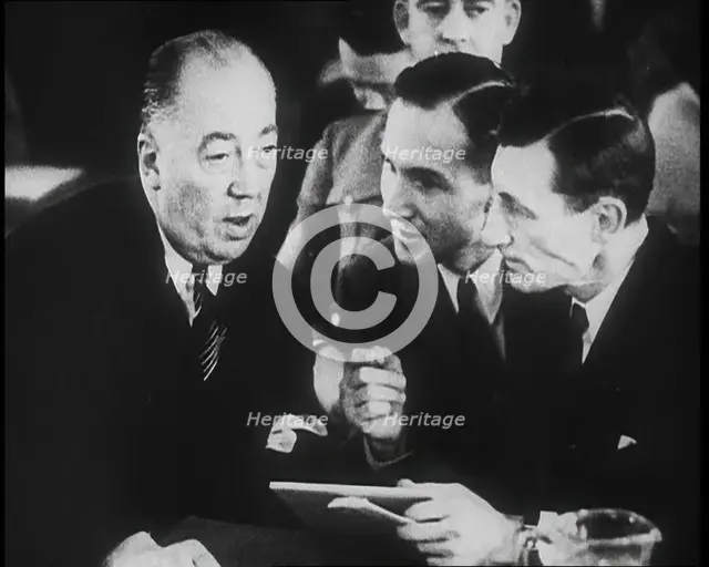 Bruno Richard Hauptmann Talking To His Attorney Edward J. Reilly in a Courtroom During His..., 1930s Creator: British Pathe Ltd.