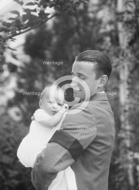 Brady, James Cox, Jr., Mr., and child, outdoors, 1930 May 24. Creator: Arnold Genthe.