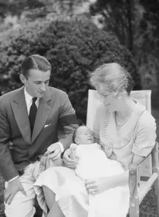 Brady, James Cox, Jr., Mr. and Mrs., and child, seated outdoors, 1930 May 24. Creator: Arnold Genthe