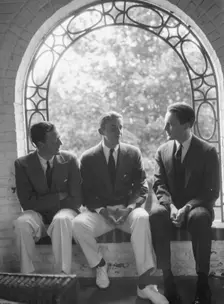 Brady, Mosely, and Scott group, seated in a window, 1930 May 24. Creator: Arnold Genthe