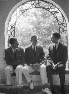 Brady, Mosely, and Scott group, seated in a window, 1930 May 24. Creator: Arnold Genthe
