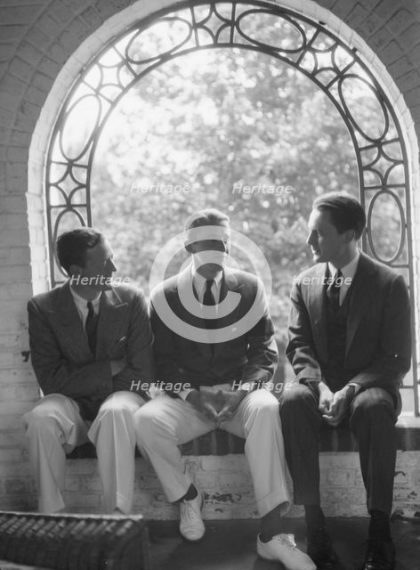 Brady, Mosely, and Scott group, seated in a window, 1930 May 24. Creator: Arnold Genthe.