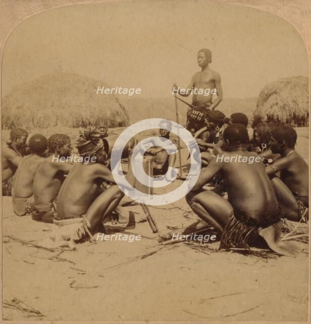 'Braves of a Zulu Village holding a Council, near the Umlaloose River, Zululand, S.A.', 1901. Artist: Unknown.