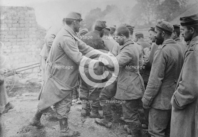 Bread to German prisoners, Champagne, between c1915 and c1920. Creator: Bain News Service.