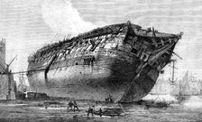 Breaking-up H.M.S. Queen at Rotherhithe, 1871. Creator: Unknown