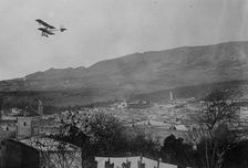 Breguet biplane, type 1910, flying over a town, possibly in Morocco, between c1910 and c1915. Creator: Bain News Service