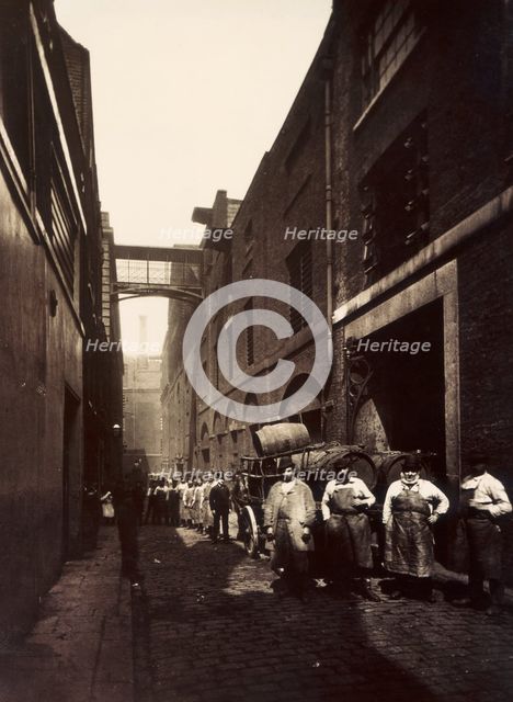 Brewery workers outside the Combe & Co's Brewery, Castle Street, St Giles Circus, London, c1875. Creator: Unknown.