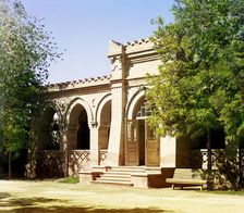 Brick building with arched entrance and arcade, between 1905 and 1915. Creator: Sergey Mikhaylovich Prokudin-Gorsky