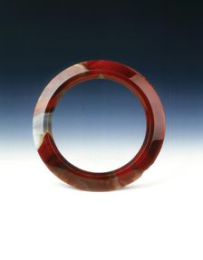 Brick-red agate pectoral ring, Western Han dynasty, 206 BC-8 AD