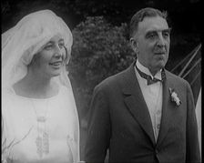 Bride and Groom Standing for Photographs, 1921. Creator: British Pathe Ltd