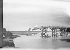 Bridge partially extended over a body of water, Japan, 1908. Creator: Arnold Genthe
