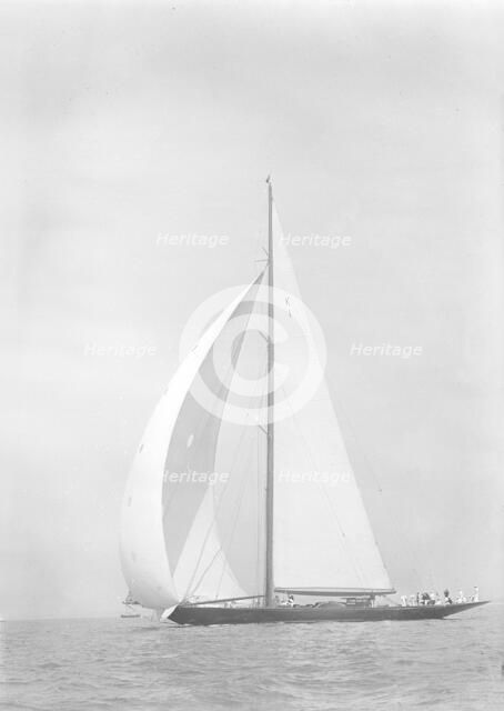 'Britannia' sails downwind under spinnaker, 1935. Creator: Kirk & Sons of Cowes.