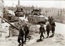 British 8th Army troops and tanks on the road to Ferrara, Italy, April 1945