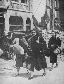 British troops hold out in Louvain as refugees leave the city 1940, (1940)