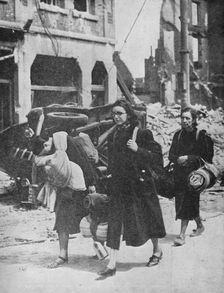 British troops hold out in Louvain as refugees leave the city 1940, (1940)