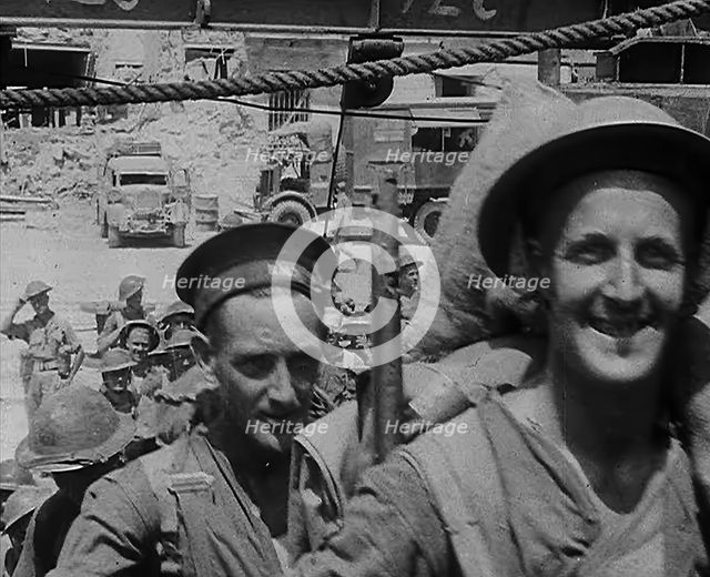 British Troops Marching Through a Dock in North Africa, 1943. Creator: British Pathe Ltd.
