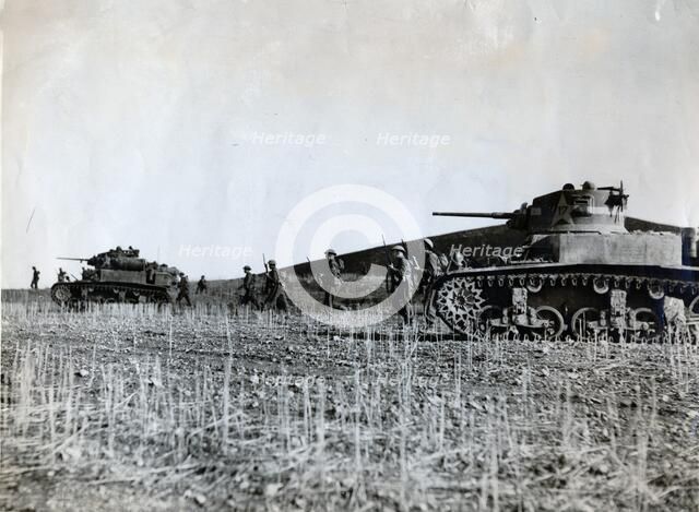 British troops supported by American tanks advance on the Tunisian front, December 1942. Artist: Unknown