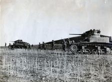 British troops supported by American tanks advance on the Tunisian front, December 1942