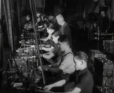 British Workers in a Factory, 1941. Creator: British Pathe Ltd