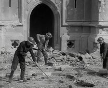 British Air Raid Wardens Clearing up Rubble Around the Palace of Westminster, 1941. Creator: British Pathe Ltd