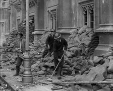British Air Raid Wardens Clearing up Rubble Around the Palace of Westminster, 1941. Creator: British Pathe Ltd