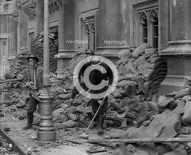 British Air Raid Wardens Clearing up Rubble Around the Palace of Westminster, 1941. Creator: British Pathe Ltd.