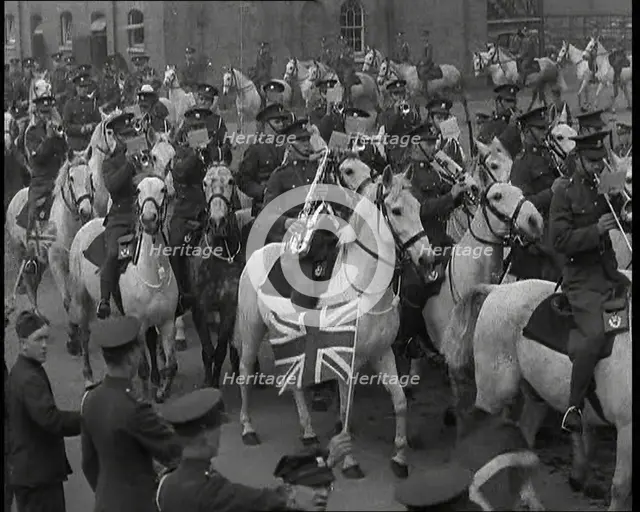 British Army Band on Horseback Parading Down a Street, 1937. Creator: British Pathe Ltd.