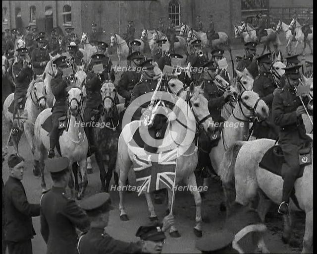 British Army Band on Horseback Parading Down a Street, 1937. Creator: British Pathe Ltd.