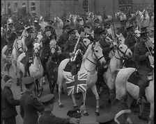 British Army Band on Horseback Parading Down a Street, 1937. Creator: British Pathe Ltd