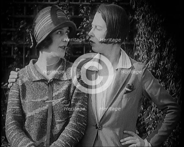 British Artists Norah Blaney and Gwen Farrah Posing for the Camera Smiling at Each Other, 1920. Creator: British Pathe Ltd.
