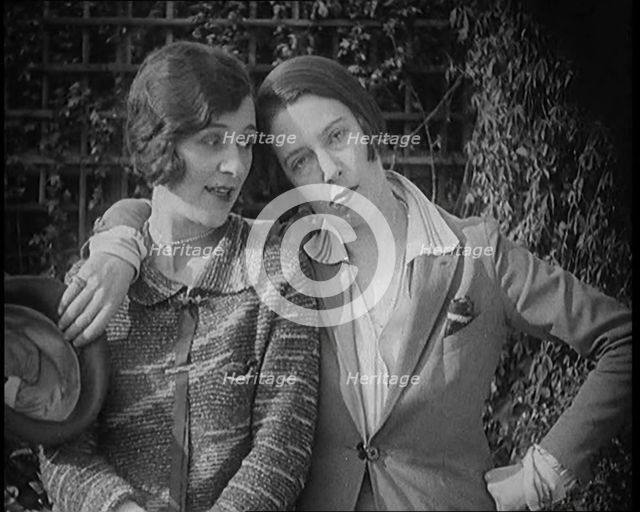 British Artists Norah Blaney and Gwen Farrah Posing for the Camera Smiling at Each Other, 1920. Creator: British Pathe Ltd.