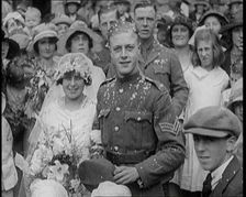 British Bride and Groom Smiling for the Camera at Their Wedding, 1921. Creator: British Pathe Ltd
