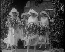 British Bridesmaids Walking Through a Flowery Arch, Holding Flowers, 1921. Creator: British Pathe Ltd
