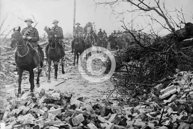 British Cavalry passing thro' wrecked village, 21 Apr 1917.. Creator: Bain News Service.