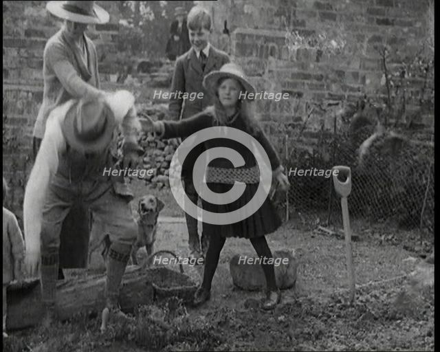British Chancellor of the Exchequer Joseph Austen Chamberlain Working in the Garden With His...,1920 Creator: British Pathe Ltd.