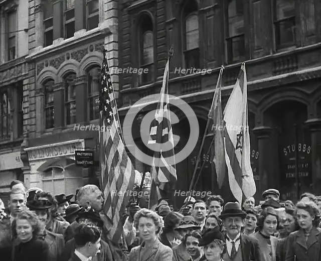 British Civilians Watching American Troops March Through London, 1942. Creator: British Pathe Ltd.