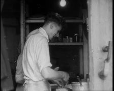 British Cooks Preparing Food for Soldiers Aboard a Ship Evacuating Dunkirk, 1940. Creator: British Pathe Ltd