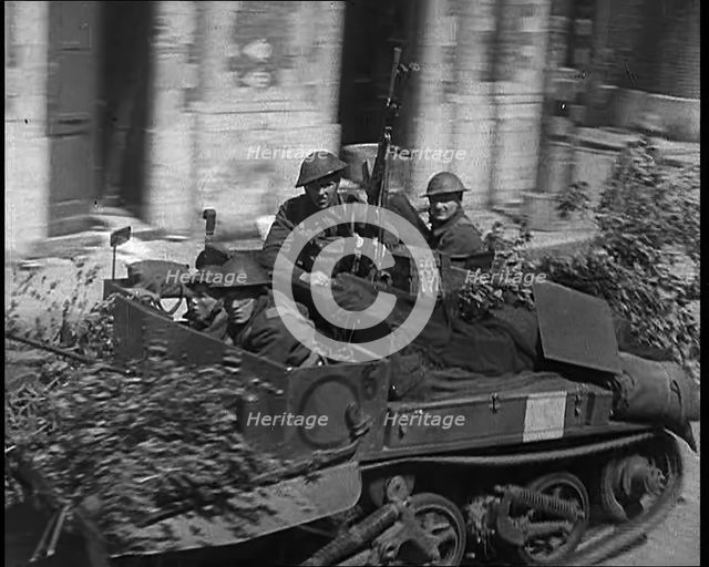 British Expeditionary Force Retreating Through Belgian Town on Vehicles, 1940. Creator: British Pathe Ltd.