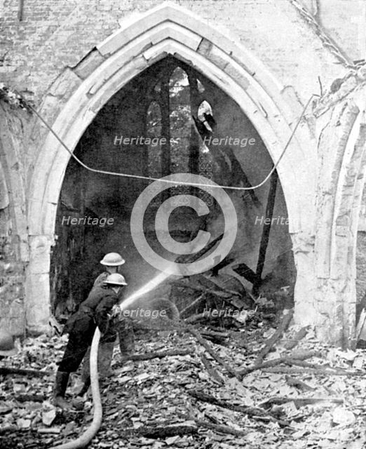 British firefighters damping down a bombed church, World War II, June 1940. Artist: Unknown
