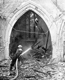 British firefighters damping down a bombed church, World War II, June 1940