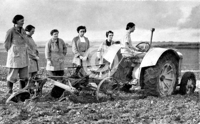 British girls of the Women's Land Army learning to plough with a tractor, World War II, 1939-1945. Artist: Unknown